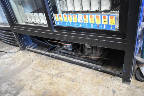 True GDM-41C-48 commercial cooler, 2 doors, poly coated racks. Visible labels. 115V, 1 phase. Used condition.