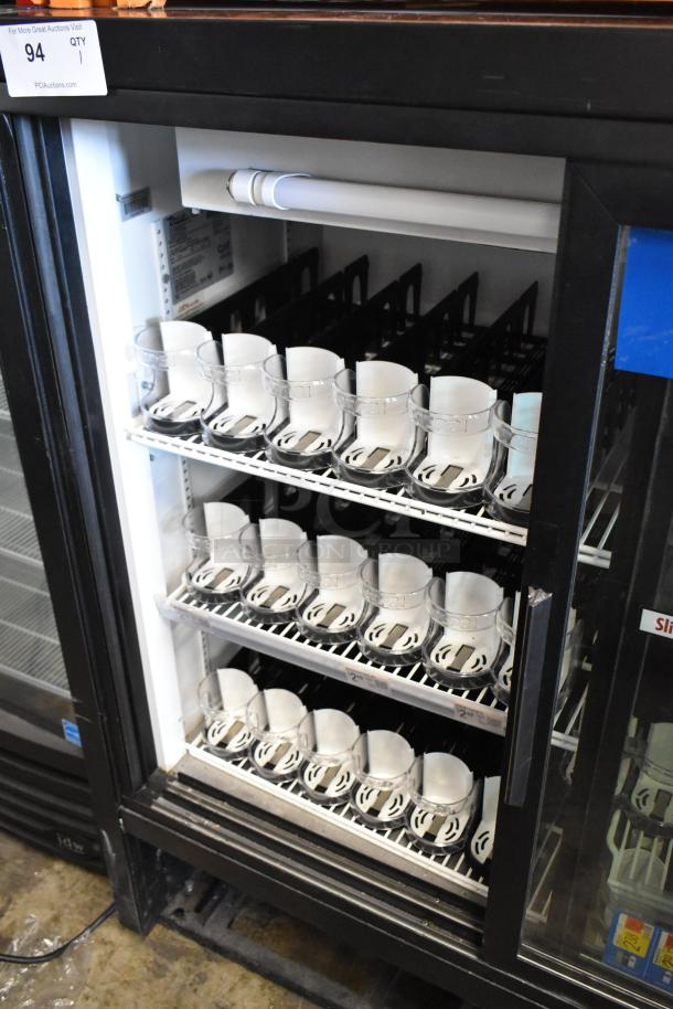 True GDM-41C-48 commercial cooler with two glass doors, poly-coated racks, metal frame; model and specs visible inside.