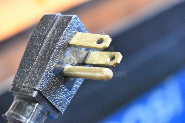 Close-up of a three-prong plug for the True GDM-41C-48 cooler.