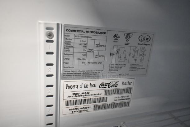 IDW G-10-F334B-HC commercial cooler with single door, poly-coated racks, 115V, 1 phase. Label shows model and specs.