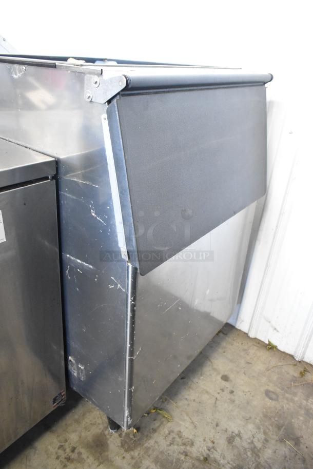 Hoshizaki B-500PF Metal Commercial Ice Bin, dented, with some surface scratches, suitable for high-volume ice storage.