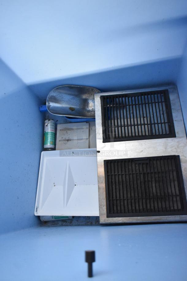 Hoshizaki B-500PF metal commercial ice bin interior, showing metal scoop, grates, and cleaning supplies. Good condition.