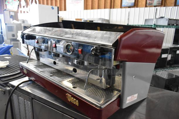 Wega Atlas LPUS Metal Commercial 3 Group Espresso Machine with 2 steam wands, gloss finish, and visible Wega logo.