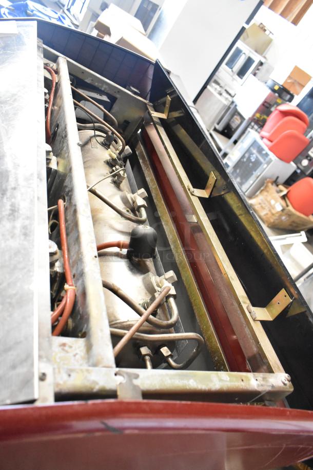 Wega Atlas LPUS metal commercial 3 group espresso machine with 2 steam wands, interior view, used condition.
