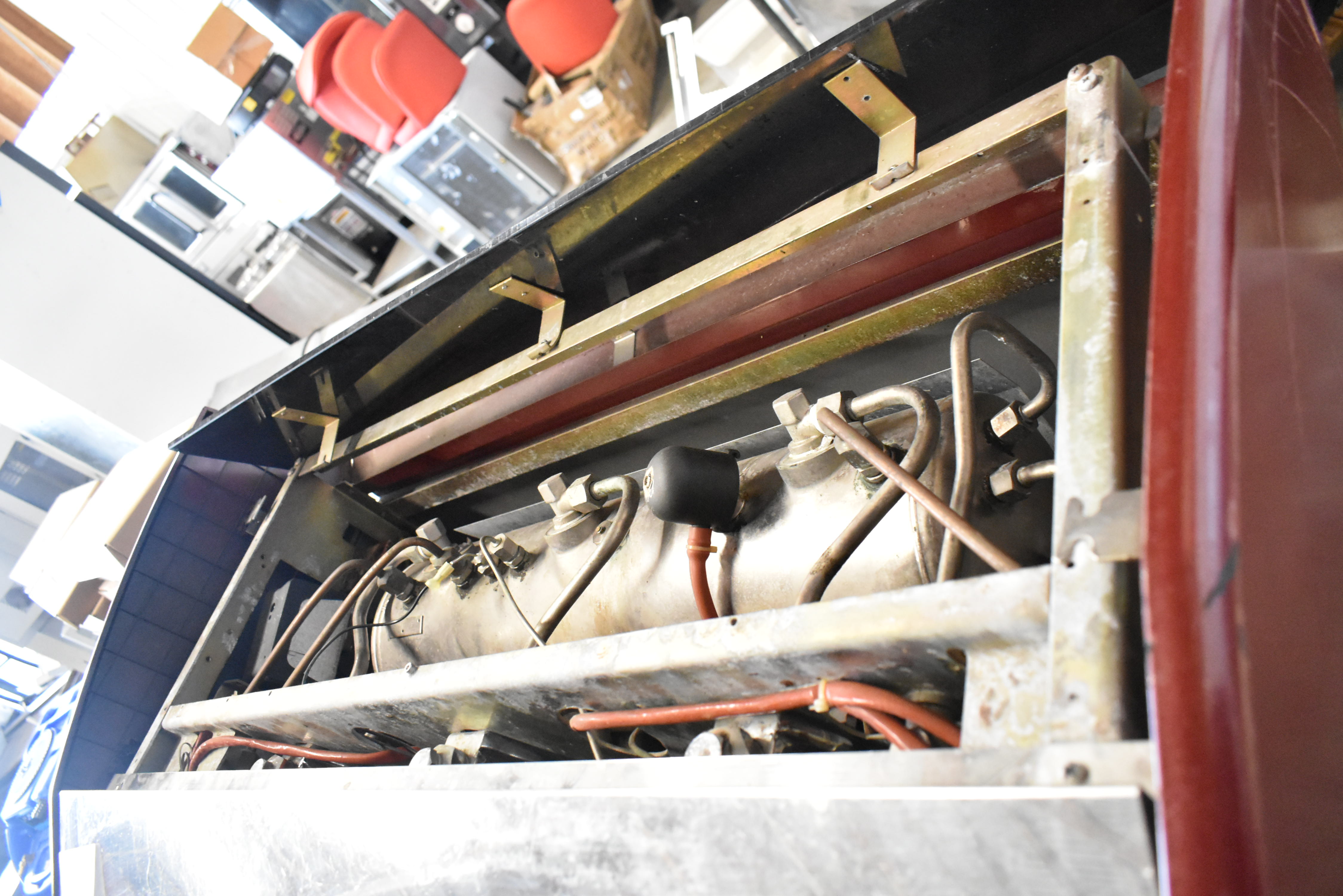 Internal boiler view of espresso machine with top panel removed