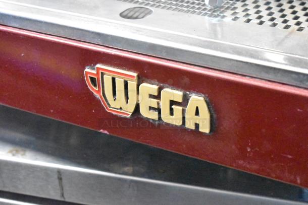 Wega Atlas LPUS commercial espresso machine, metal body, 3 group, 2 steam wands, logo displayed. 230V.