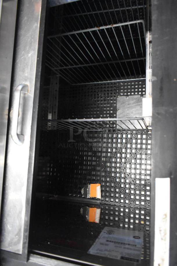 Perlick BC48-1 commercial back bar cooler with metal finish, two sliding lids, and commercial casters, 115 volts, 1 phase.