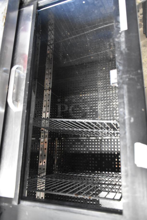 Perlick BC48-1 commercial bottle cooler with two sliding lids and commercial casters, metal construction, 115V, 1 phase.
