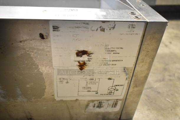 Arctic Air stainless steel commercial refrigerated rail, missing lid, visible labels, 115 volts, 1 phase, shows wear.