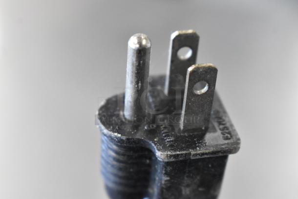 Close-up of a standard power plug for the Avantco 177W43 stainless steel food warmer, showing prongs and slight wear.