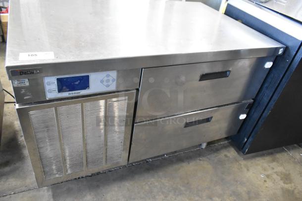 Delfield stainless steel 2-drawer chef base, commercial casters, 115V, 1 phase, visible control panel, used condition.