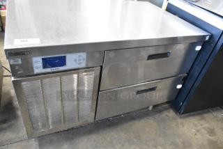 Delfield stainless steel 2-drawer chef base, commercial casters, 115V, 1 phase, visible control panel, used condition.