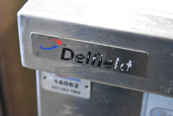 Delfield stainless steel chef base with 2 drawers, on commercial casters, 115 volts, 1 phase, with visible brand logo.