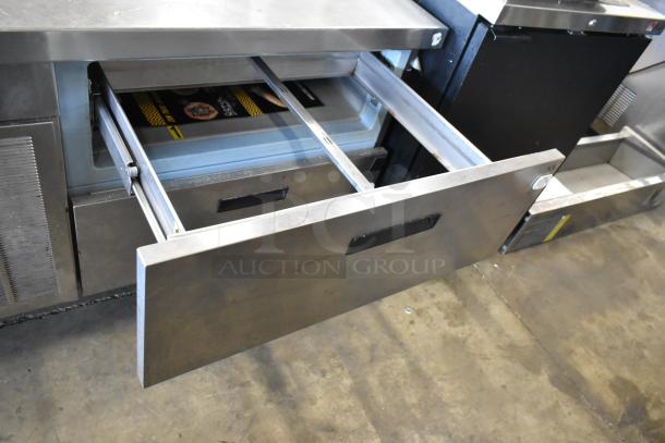 Delfield stainless steel 2-drawer chef base with commercial casters, 115 volts, 1 phase, shown with open drawer.
