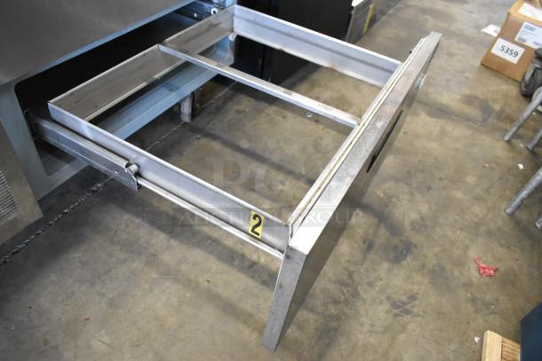 Delfield stainless steel 2-drawer chef base on commercial casters, 115 volts, 1 phase, numbered label "2," in used condition.