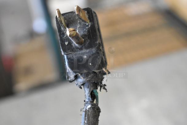Damaged power cord of Perlick BS2DS cooler, showing frayed insulation and exposed wires, affecting functionality.