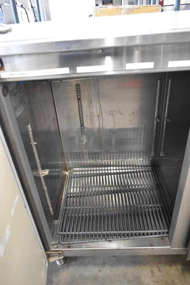 Perlick BS2DS stainless steel 2-door undercounter cooler, commercial-grade, 115 volts, 1 phase, interior shelf visible, signs of wear.