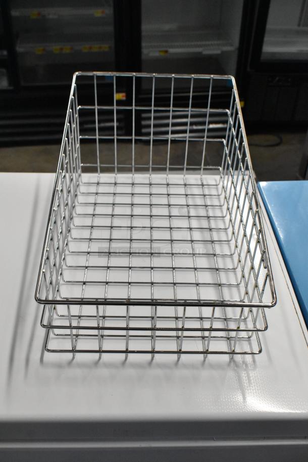 Metal wire basket, rectangular, stacked, used condition, part of a lot with stainless steel bin.