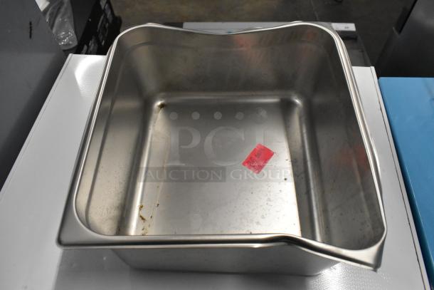 Stainless steel bin with moderate wear, visible red sticker marked "BD28", included in a lot with metal wire baskets.