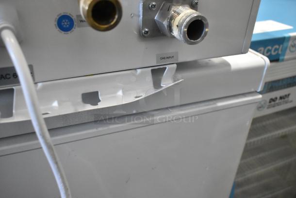 Eccotemp 6GB-ING 6.0 GPM indoor natural gas tankless water heater, showing gas input connections and labels.