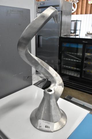 Metal commercial dough hook attachment for mixer, in good condition. Visible tag with auction number 109.