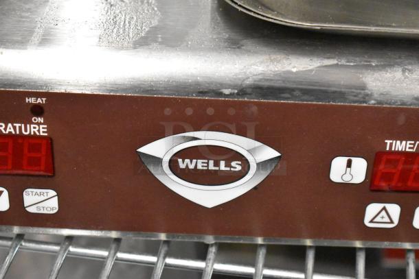 Wells WB2E Commercial Double Waffle Maker, countertop model, 208/240 volts, 1 phase, control panel with Wells logo.