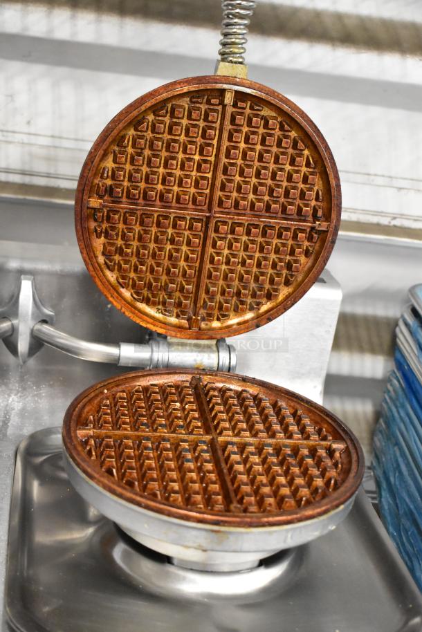 Wells WB2E metal commercial countertop double waffle maker, open view, shows grid pattern, 208/240 volts, 1 phase.