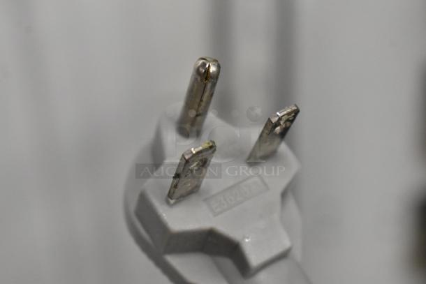 Close-up of a three-prong power plug for Wells WB2E Double Waffle Maker, 208/240 Volts, 1 Phase, showing wear.