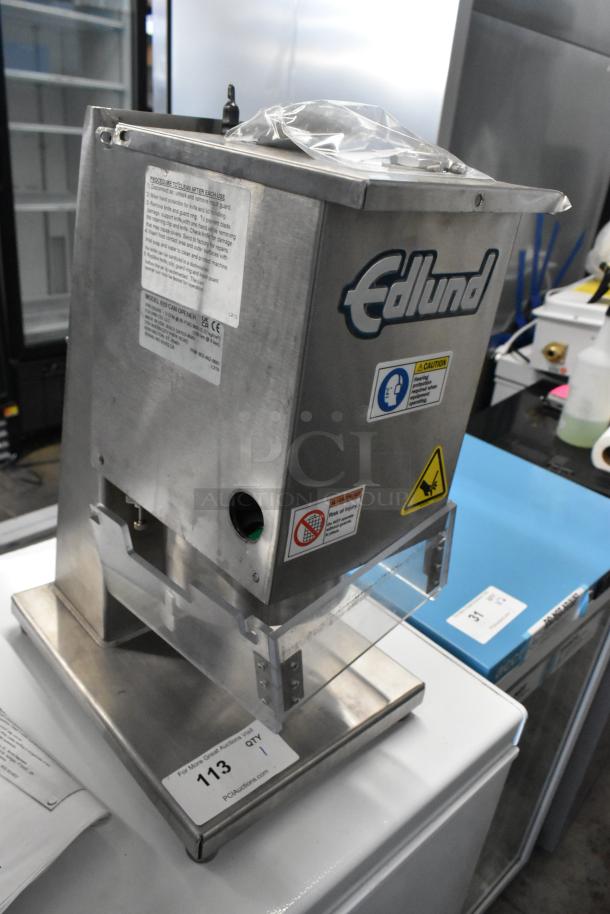 BRAND NEW Edlund 610 Air Powered Crown Punch Can Opener. Visible labels show safety instructions and model details. Minor scratches.