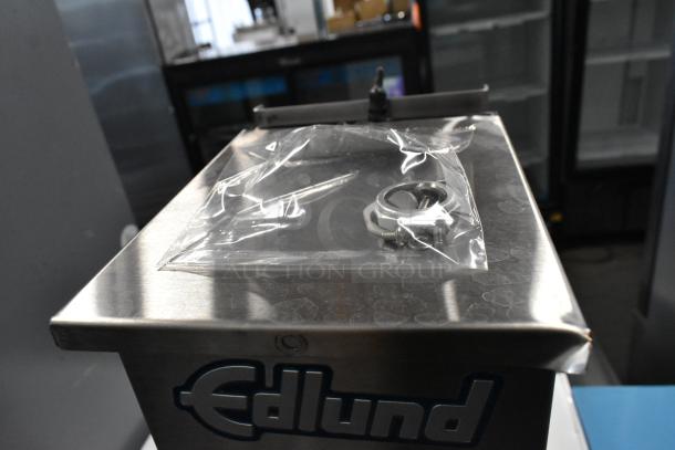 Brand new Edlund 610 Air Powered Crown Punch Can Opener, scratch and dent condition, visible packaging on top.