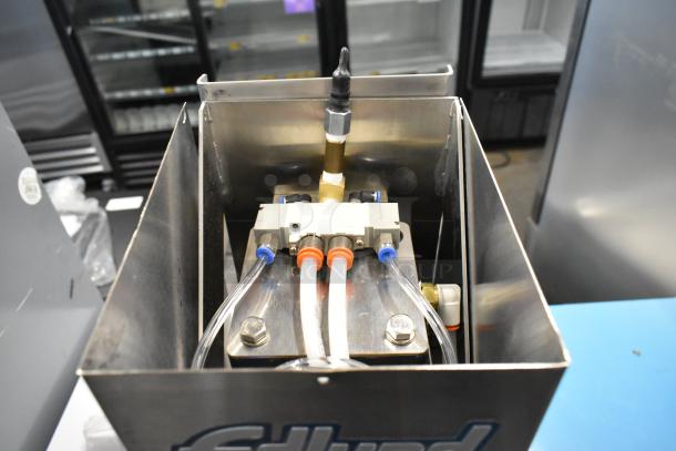 BRAND NEW SCRATCH AND DENT! Edlund 610 Air Powered Crown Punch Can Opener, showing internal components and Edlund branding.