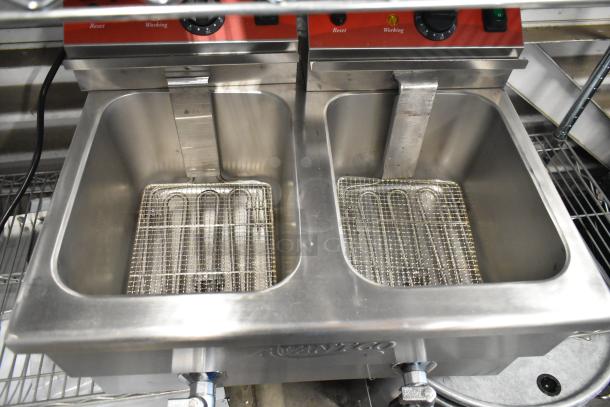 Brand new 2025 Avantco 177F202 stainless steel dual tank fryer, 30 lb. capacity, with 2 metal baskets; minor scratches.