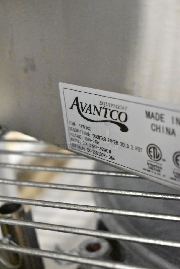 Brand new Avantco 177F202 stainless steel electric fryer with dual tanks, metal baskets, and lids. Scratch and dent condition.