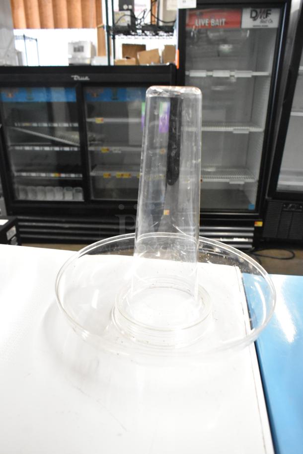 Brand new clear poly beverage dispenser with visible cracks, scratch and dent condition. Auction offers 2 items.