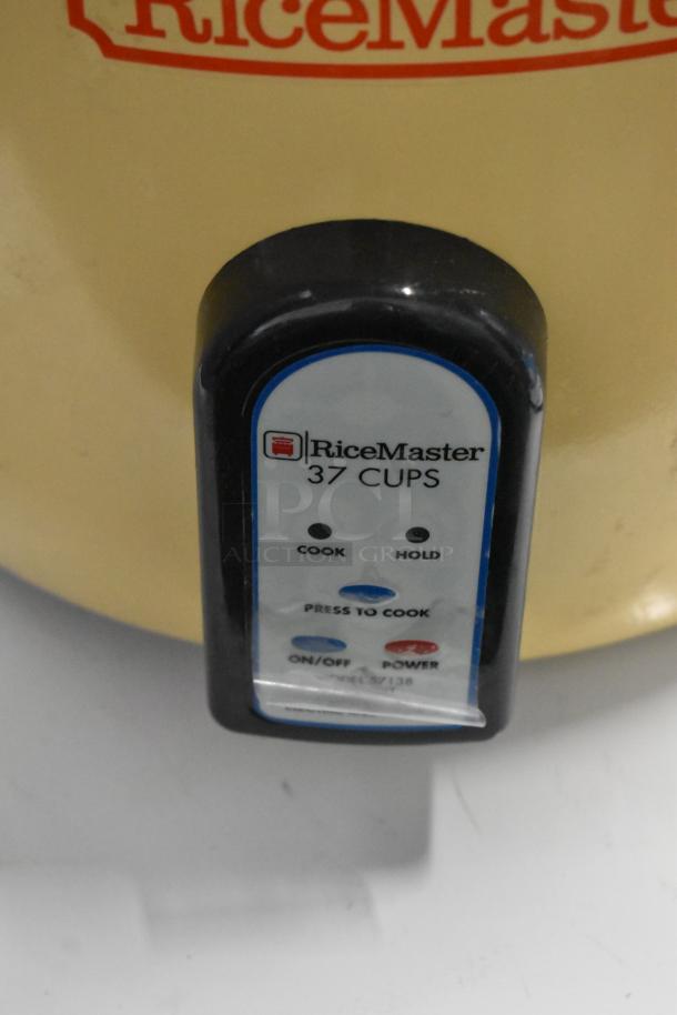 Brand new RiceMaster Town 57138 rice cooker/warmer, 74 cup capacity, 230V, minor dents, label shows "37 CUPS."