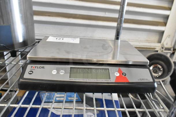 Brand new Taylor TE22OS 22 lb. digital portion control scale with oversized platform; scratch and dent condition.