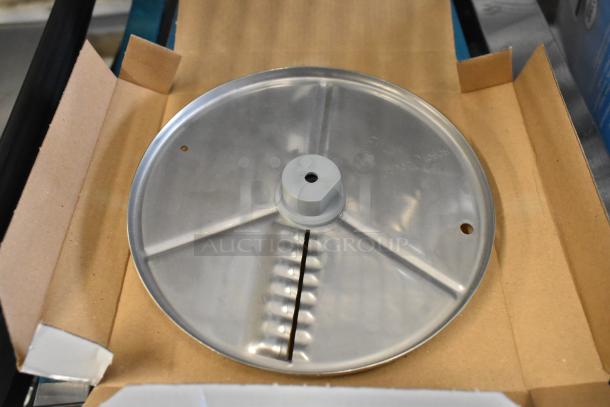 Brand new Robot Coupe 27621 5/64" ripple cut disc, visible scratch and dent, gray metallic finish, in box.