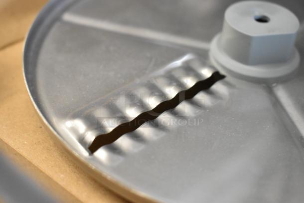 BRAND NEW SCRATCH AND DENT Robot Coupe 27621 5/64" ripple cut disc in stainless steel, minor cosmetic flaws.