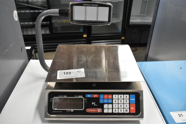 Brand new Torrey PC-40LT 40 lb. digital price computing scale with minor scratches, features numeric keypad, and display.