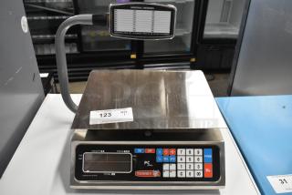 Brand new Torrey PC-40LT 40 lb. digital price computing scale with minor scratches, features numeric keypad, and display.