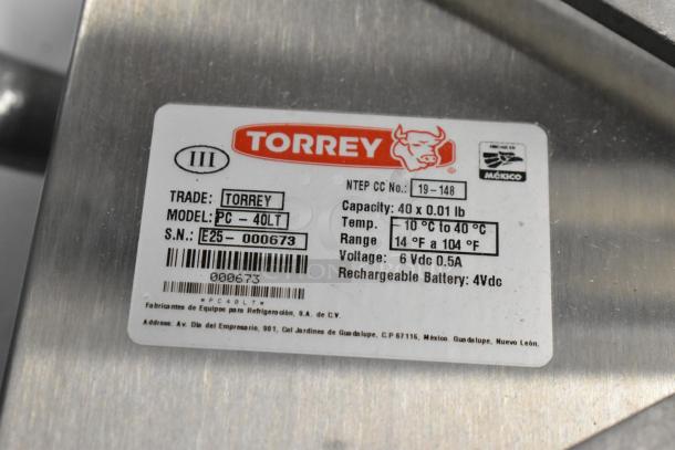 Alt text: Torrey PC-40LT digital price computing scale, 40 lb. capacity. Model label with specs visible. Brand new, scratch and dent condition.
