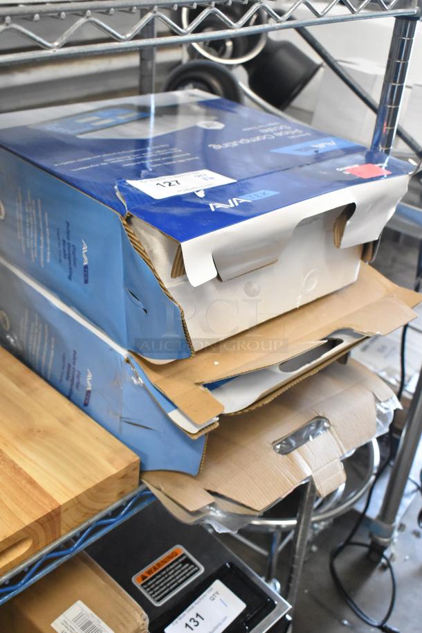 Two AvaTek digital price computing scales in boxes, models PCS60 and PCS40. Boxes slightly dented but new.