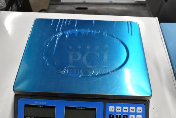 2 AvaTek digital scales, models PCS60 and PCS40, brand new with protective film. Legal for trade; scratch and dent condition.