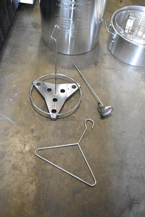 Brand new Backyard Pro metal pot for fryer, includes accessories. Slight scratches and dents visible, stainless steel finish.