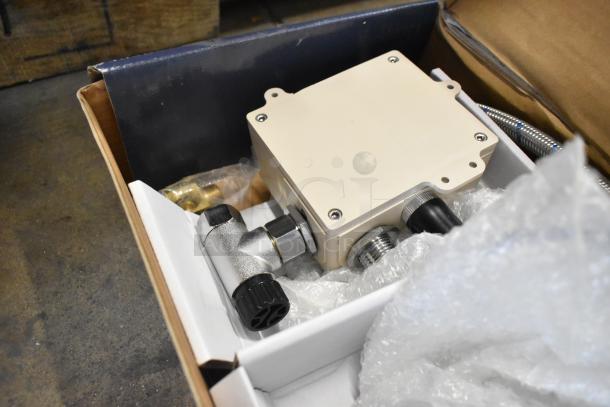 Brand new Waterloo wall and deck mount sensor faucets in packaging. Includes gooseneck spouts and concealed sensors.