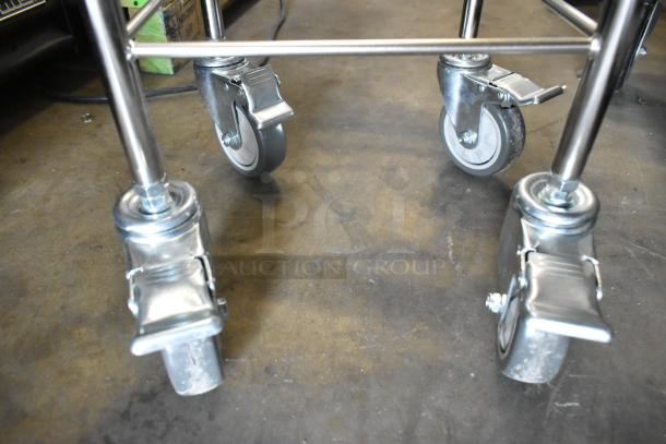 Metal commercial bowl dolly with sturdy casters, new with minor surface scratches, ideal for heavy-duty kitchen use.