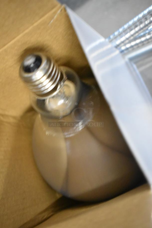 Brand new metal heat lamps in packaging, models CK2514E008 and CK2510D237, scratch and dent condition.