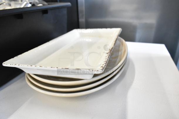 Lot of various kitchen items including white rectangular tray and three round plates in good condition.