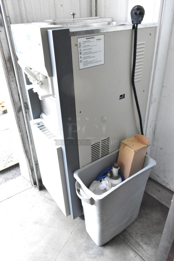Alpine OP238EC soft serve ice cream machine, 2 flavor w/ twist, metal, commercial castors, 115 volts, 1 phase, used.