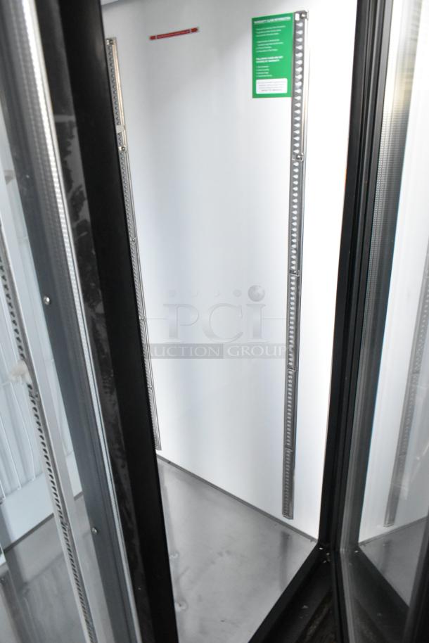 Turbo Air TGF-72SDB 3-door reach-in cooler, metal, with poly-coated racks, 115V, 1 phase, internal view.